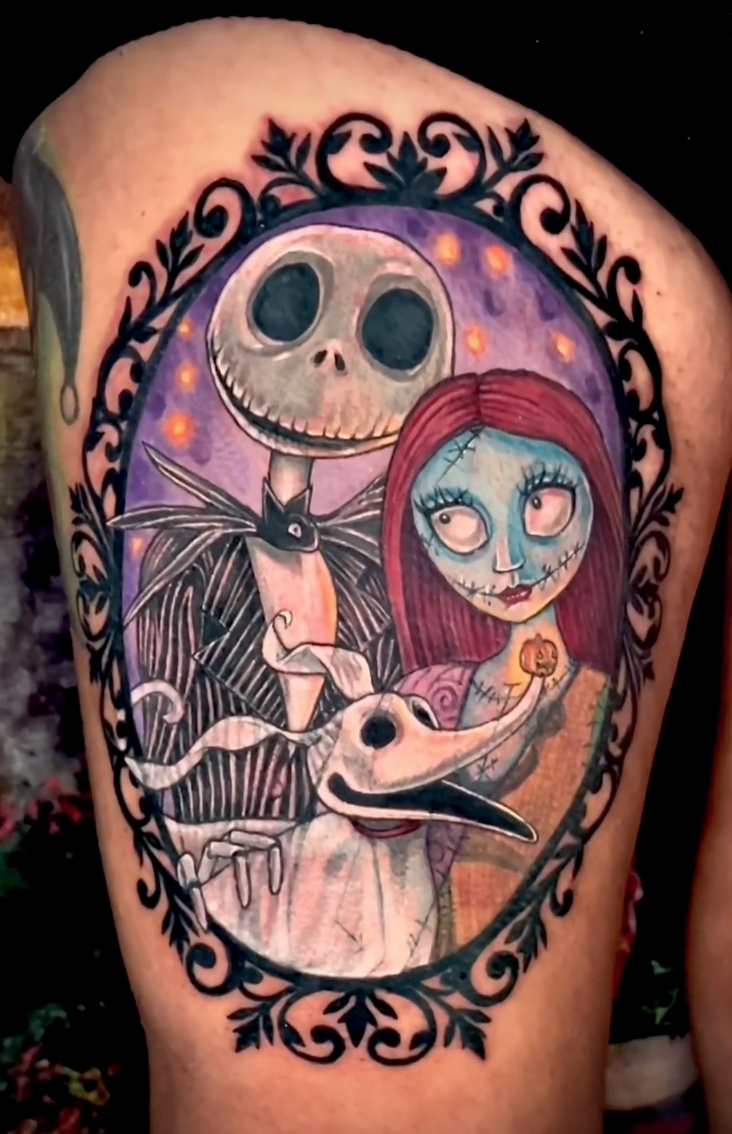 Color portrait tattoo of Jack Skellington and Sally in an ornate frame